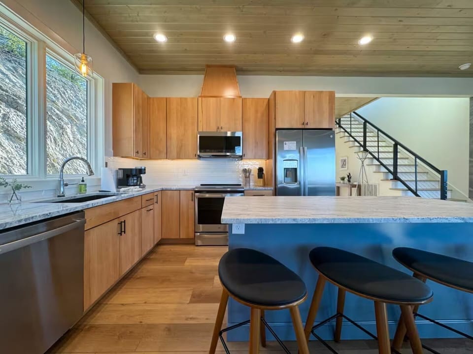 Close-up of the gourmet kitchen showing the gas range and ample prep space.