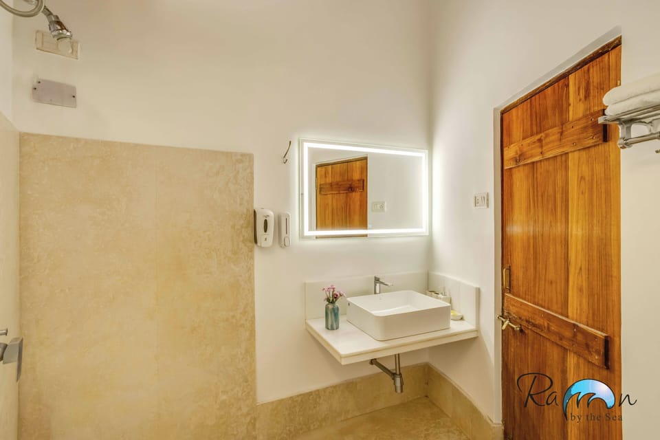 Beach Room 2 | Bathroom | Shower, free toiletries, towels, soap