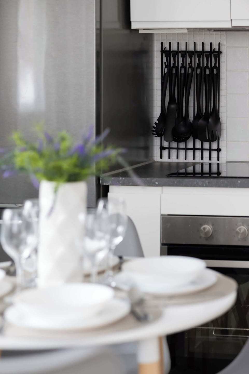 Dining table detail with tableware and decor.