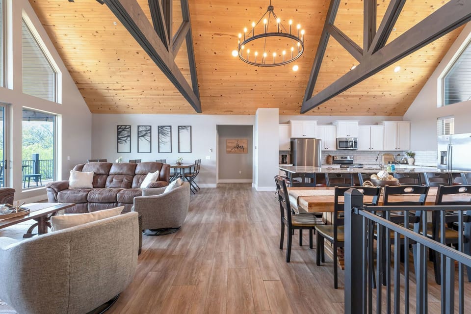 Open concept living room with tons of seating and space + a great view!