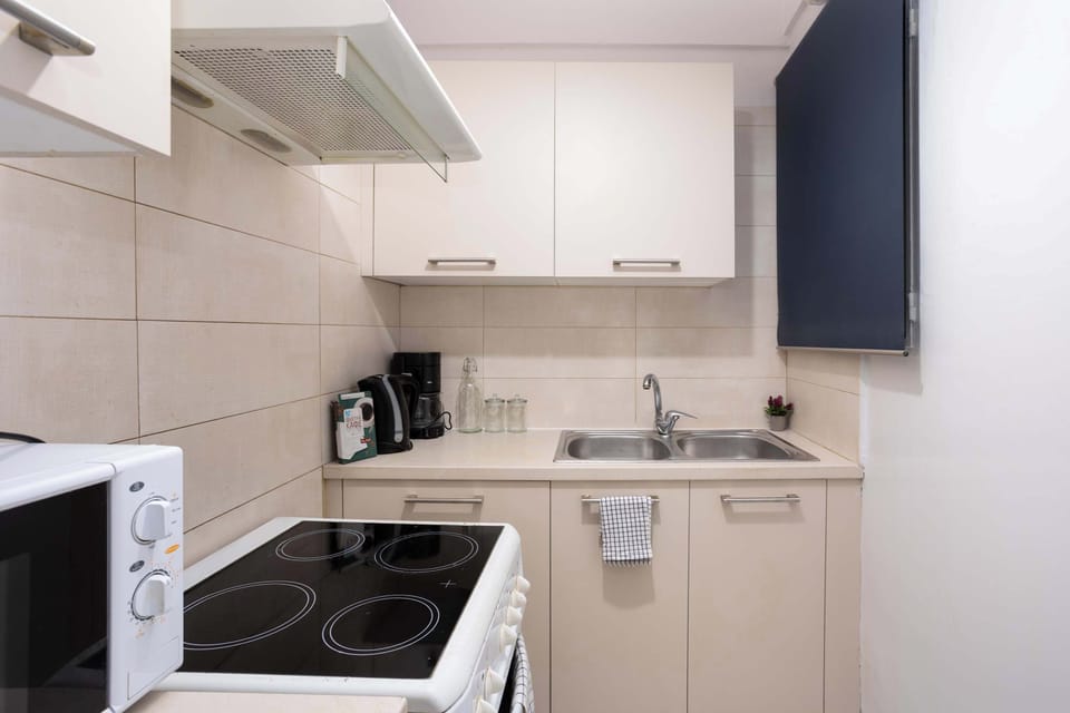 Clean, bright appliance area and amenities of the kitchen.