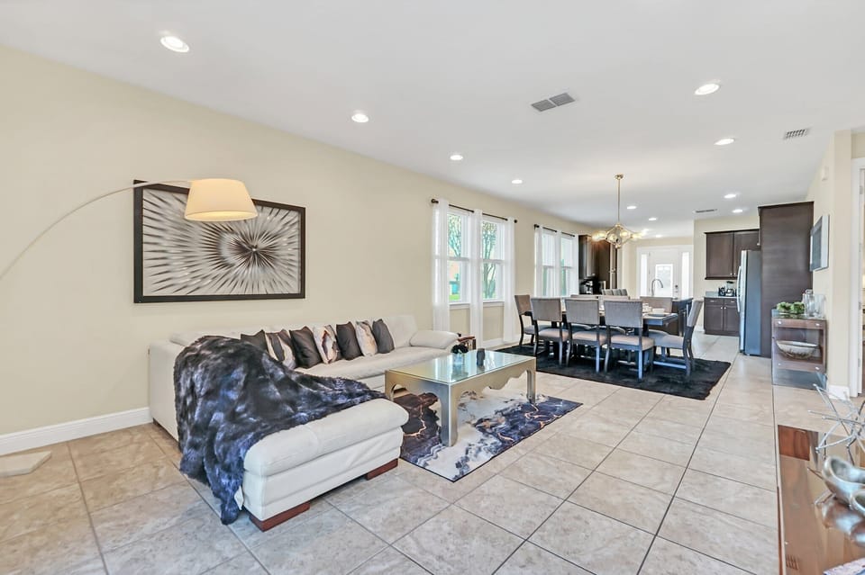 Open-concept living and dining area with modern furnishings and natural light.