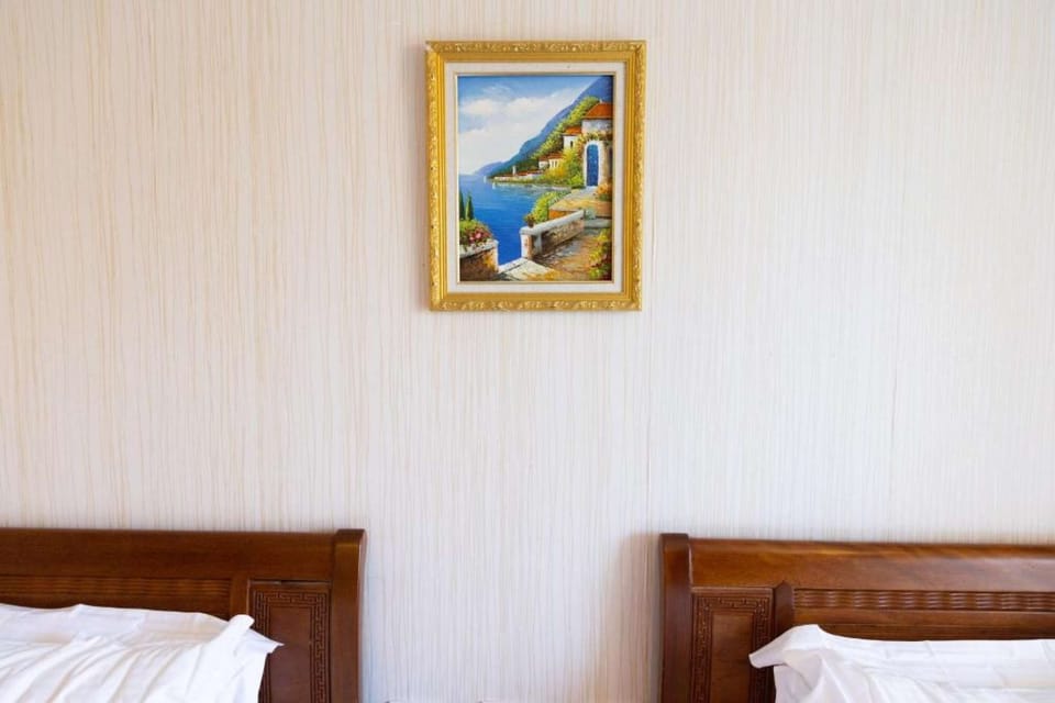Two Double Beds with frame in the middle
