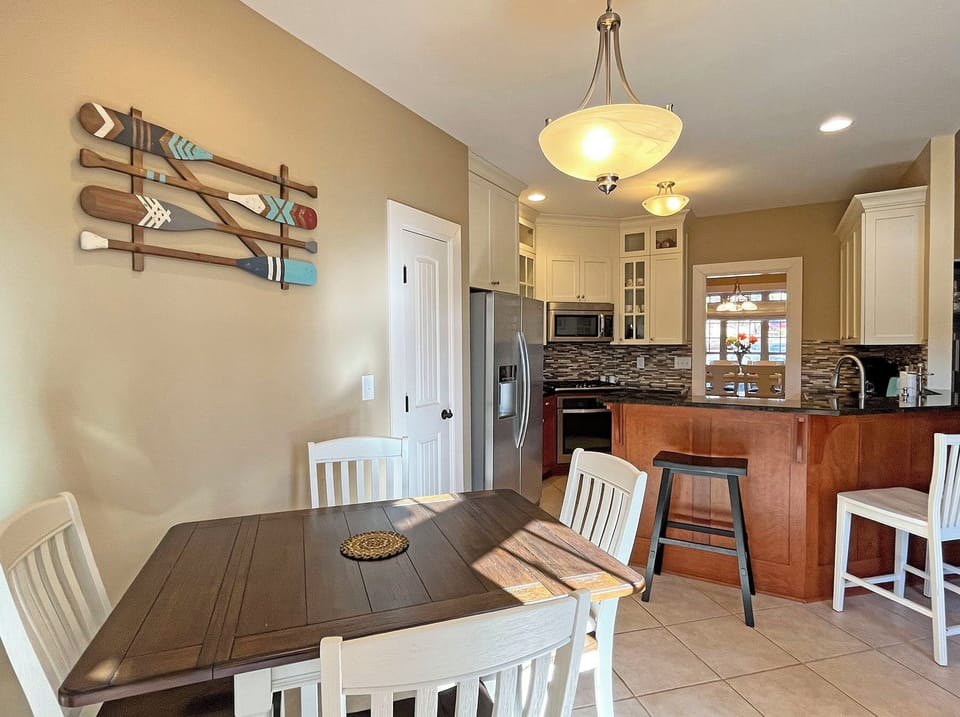 An additional table and 4 chairs at the Kitchen eating area.