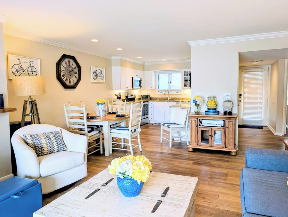 4006 Brighton Trail, sea Colony West - Living & Dining - Perspective showing the open-concept transition between the relaxing living area and the adjacent dining nook.