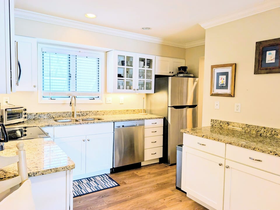 4006 Brighton Trail, sea Colony West - kitchen work space - Perspective highlighting the ample counter space, built-in microwave, and clean white finishes.