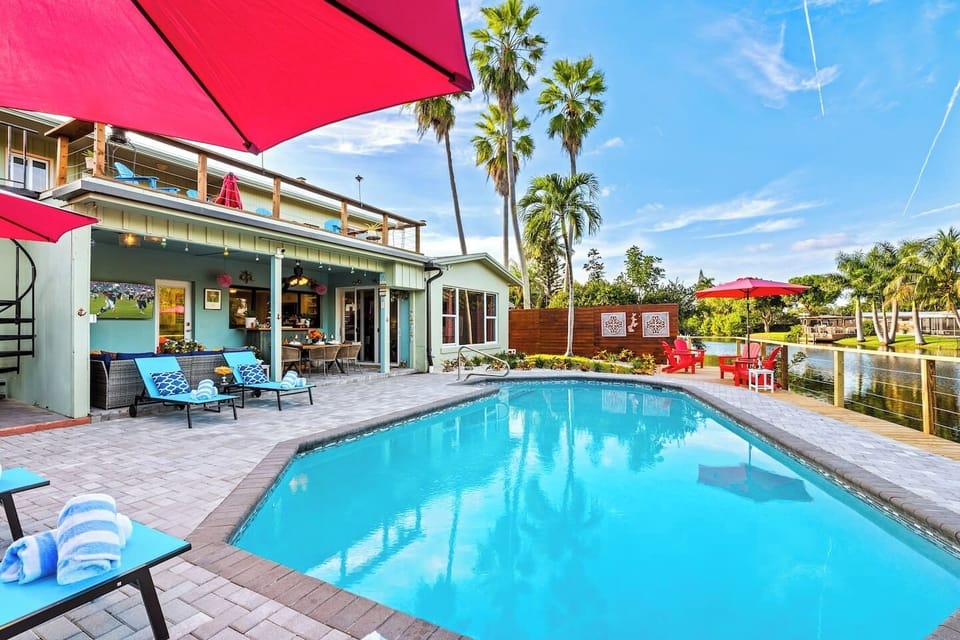 Stretch out with comfortable poolside seating and a spacious layout that makes this Fort Lauderdale waterfront backyard feel like your own private resort.