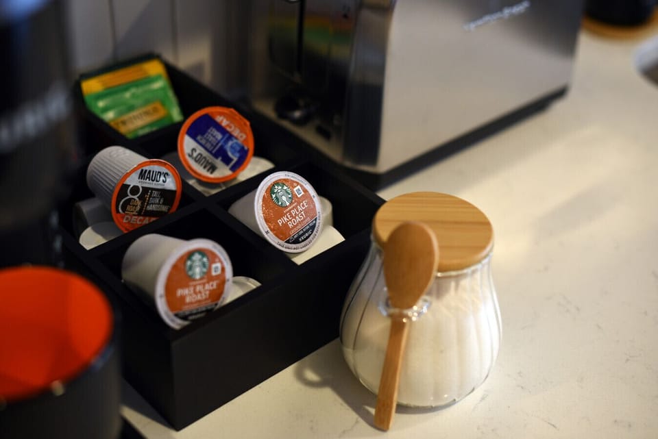 Gourmet coffee pods and sugar for the perfect brew. 🧁