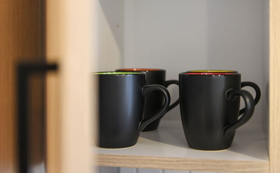 Plenty of coffee mugs.