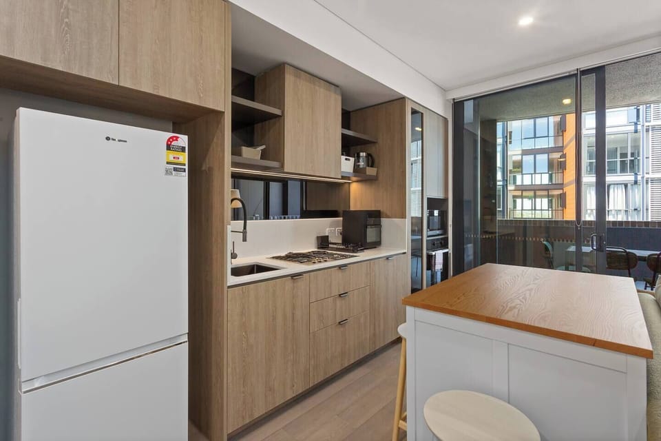 Cook with ease in the streamlined kitchen, where modern appliances and cooking essentials make everyday meals feel effortless.