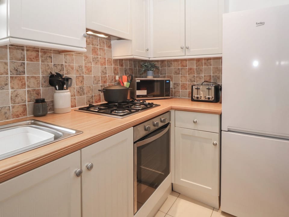 Fridge, microwave, toaster, cookware/dishes/utensils