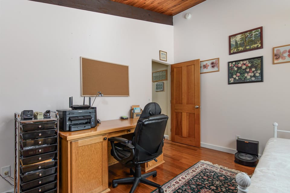 Dedicated workspace with a desk and office chair, perfect for remote work or study.