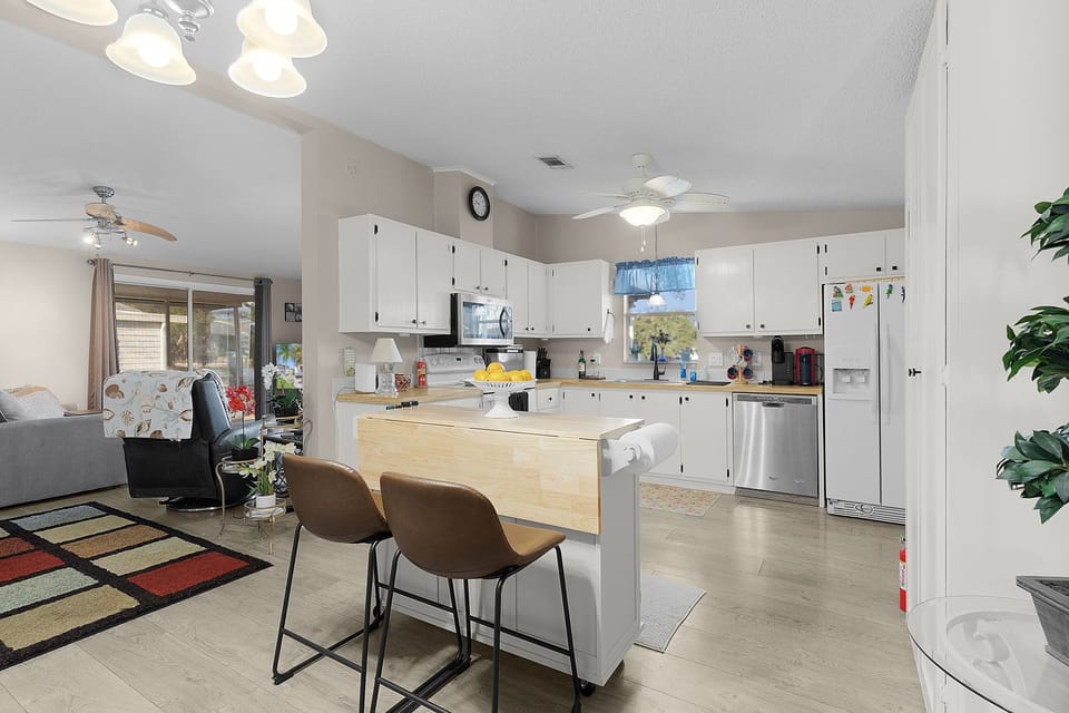 Your spacious open-concept kitchen flows seamlessly into the living area, perfect for cooking and socializing together.