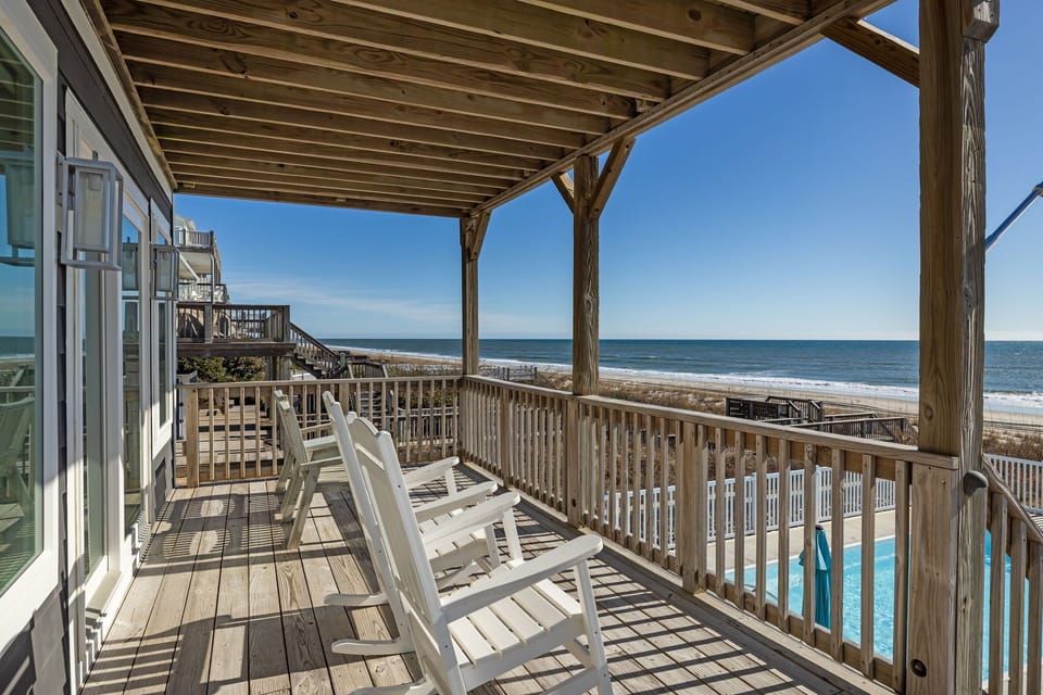 Expansive decks designed for sunrise coffee and coastal evenings.