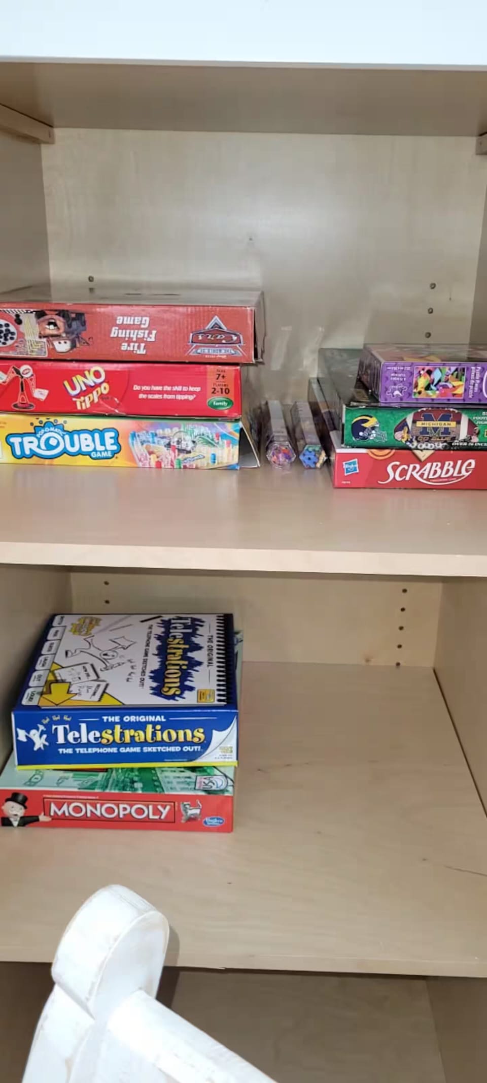 Games, there are a lot more now, plus we keep some lake towels in this pantry.