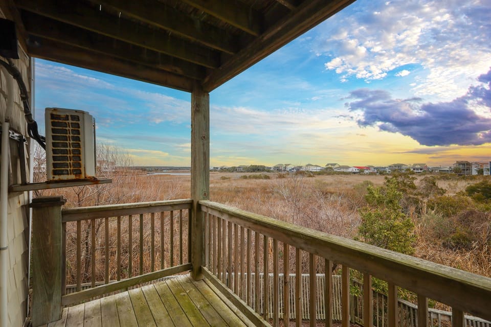 Private balcony overlooking the Intracoastal Waterway—an ideal spot to enjoy peaceful marsh views and colorful coastal sunsets