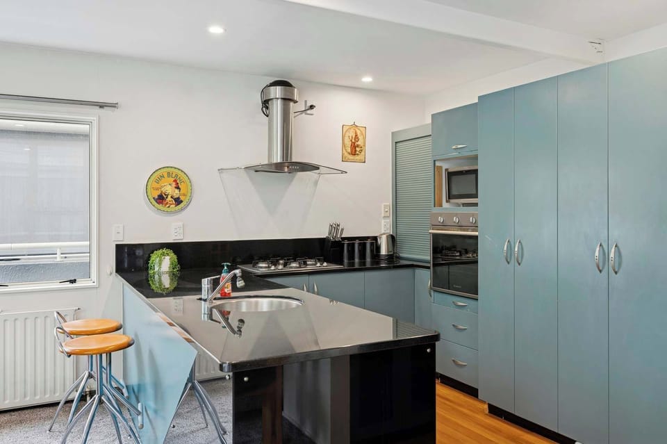 The open plan nature of the kitchen means you're fully involved with the family while cooking and you have the amazing view out the Lake Rotorua.