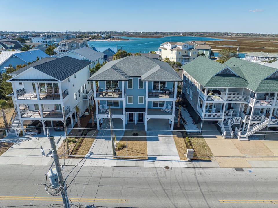Fit 4 vehicles in the garages and another 4 in the driveways. Lots of balconies!