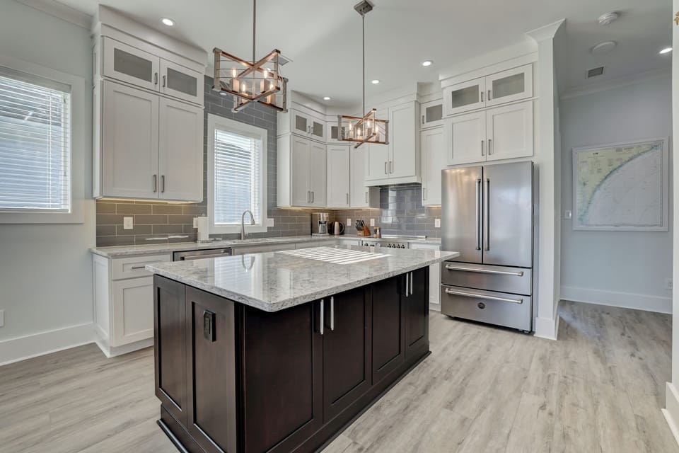 Big fridge, coffee maker & plenty of natural light! 3 bar stools out of frame.