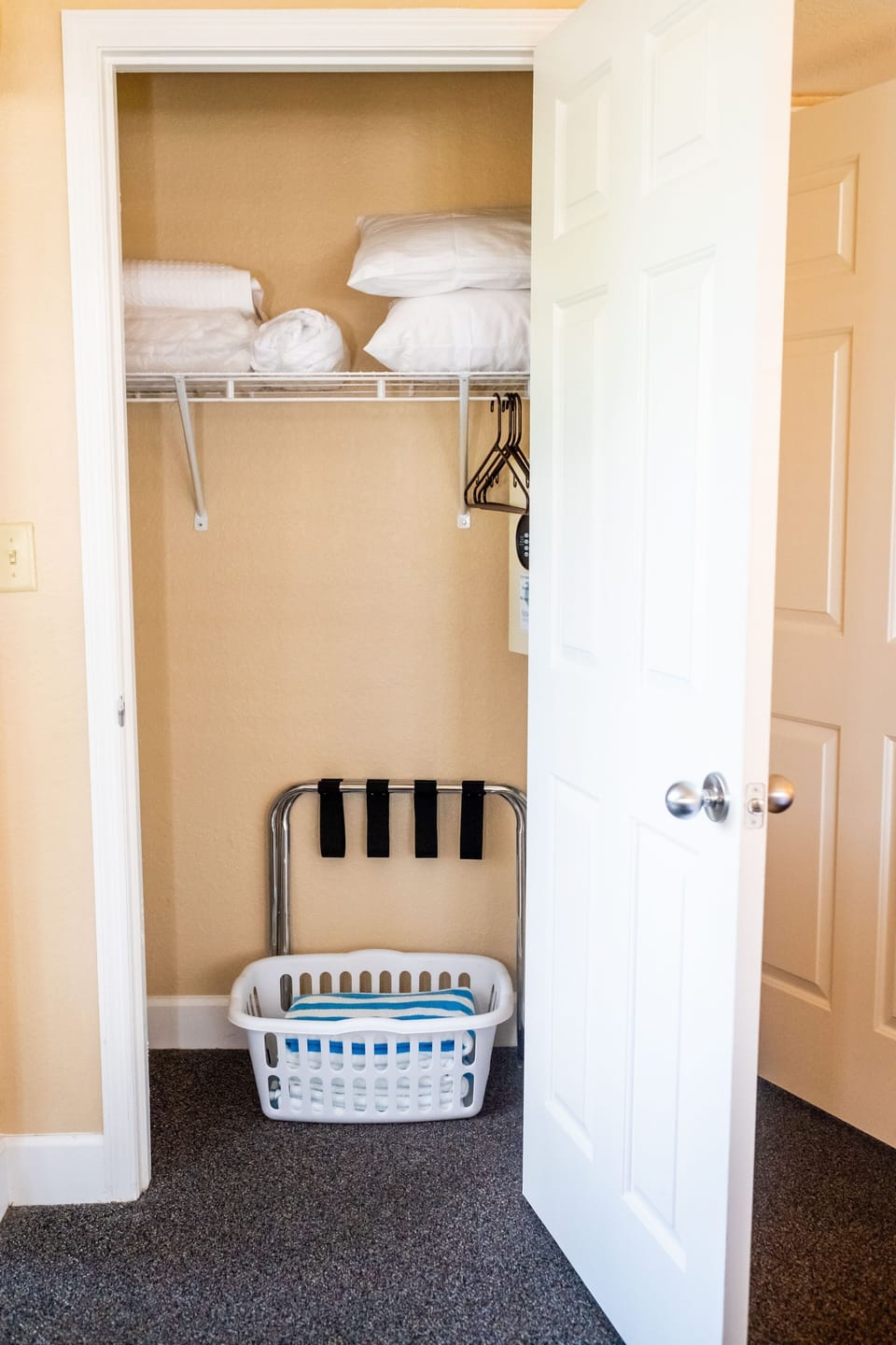 Functional closet space with organized storage for linens and essentials.
