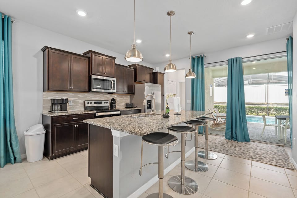 Kitchen open to pool area