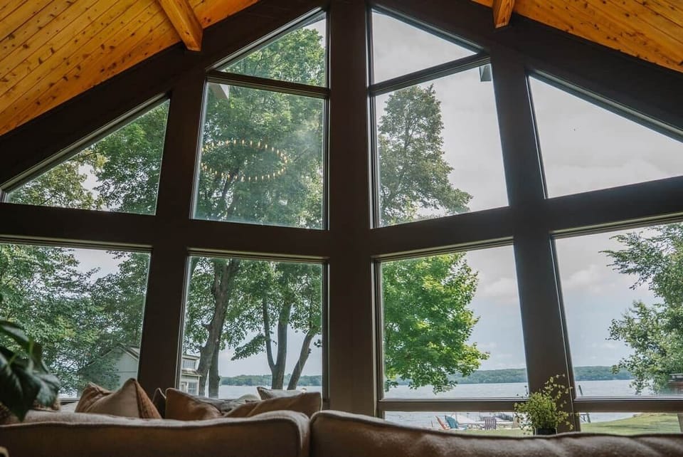 The Main Cabin
Picture the lake views framed by these soaring vaulted windows.
