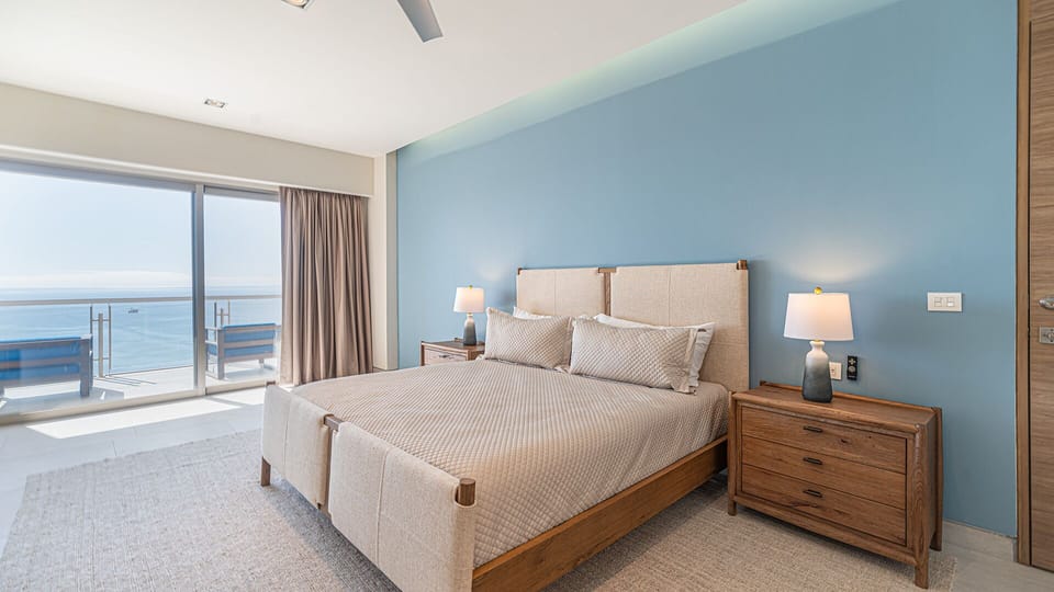 The king sized bed and end tables