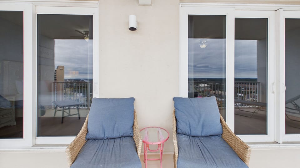 Walk out to your spacious balcony with ample seating and lounger for elevated relaxation during your stay