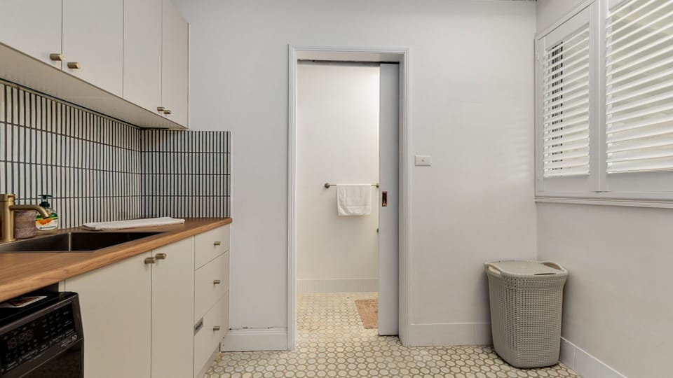 Convenient laundry area with washer and storage