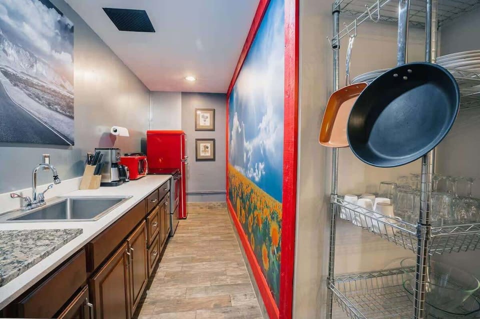 Fully equipped kitchen with modern appliances, nature themed decor, and plenty of counter space for easy meal prep.