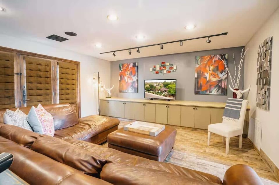 Bright and open living area featuring cozy furnishings and a Smart TV.