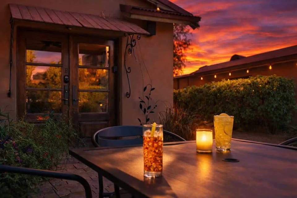 Shared front yard with multiple outdoor dining areas.