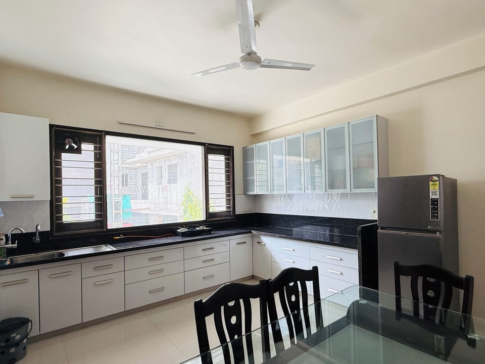Modular well equiped kitchen with crockery and other fecilities.