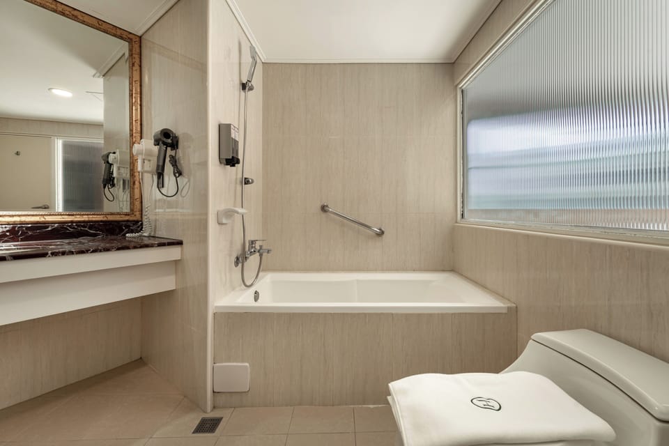 Standard Quadruple Room | Bathroom | Hair dryer, slippers, towels, shampoo