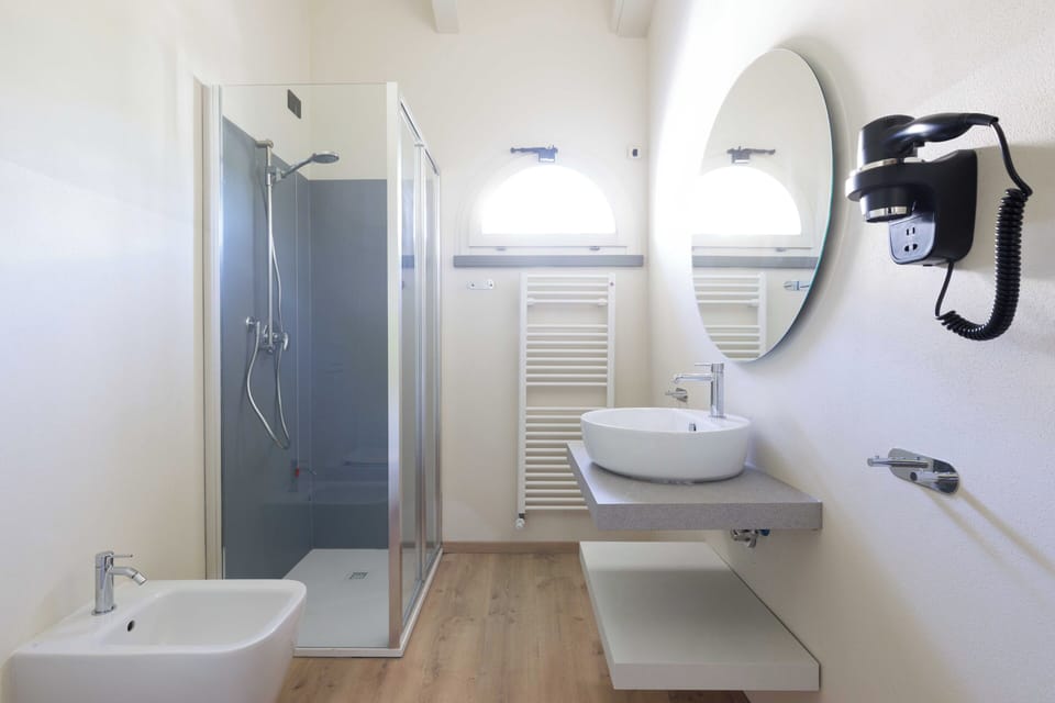 Suite, Patio, Pool View | Bathroom | Shower, hair dryer, towels, soap