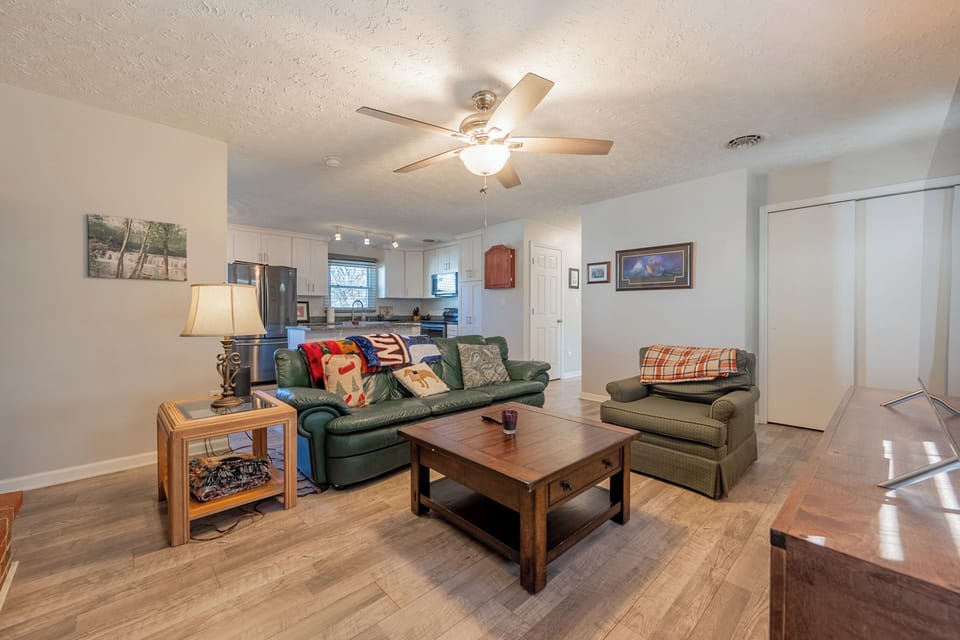 Relax in this bright, open living space—perfect for lounging, chatting, or enjoying a quiet night in.