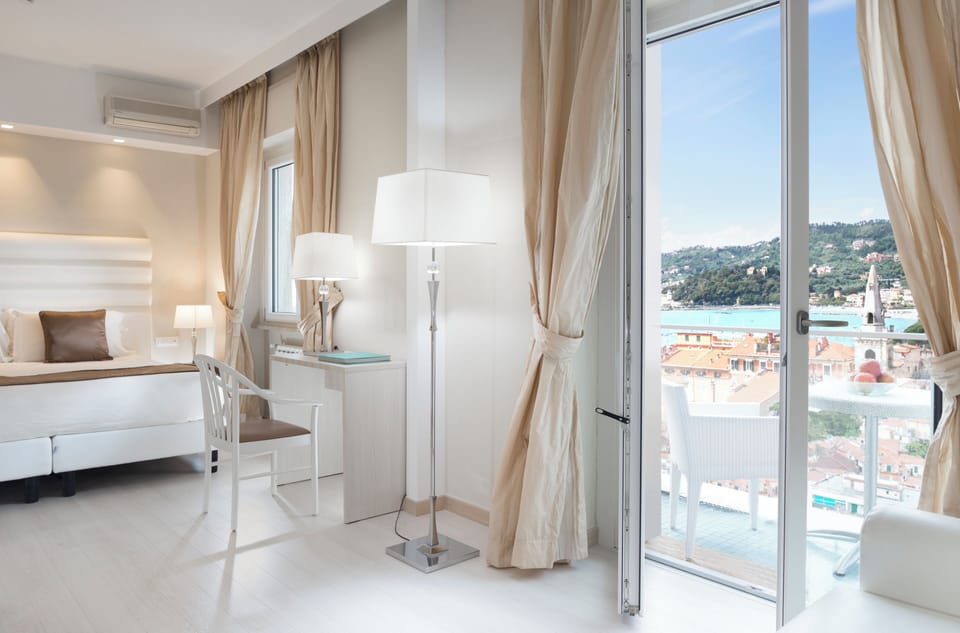Deluxe Quadruple Room, Balcony, Sea View | Minibar, in-room safe, soundproofing, free WiFi