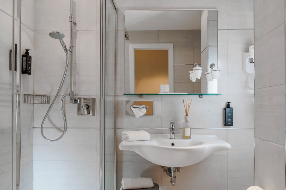 Junior Suite, Sea View | Bathroom | Bathrobes, slippers