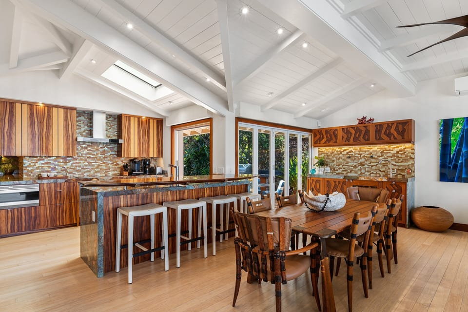 Share meals and stories at the spacious dining table nestled beside the open living area