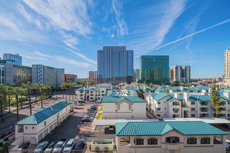 Urban skyline panorama showcasing the property's prime location amid city towers and downtown amenities.