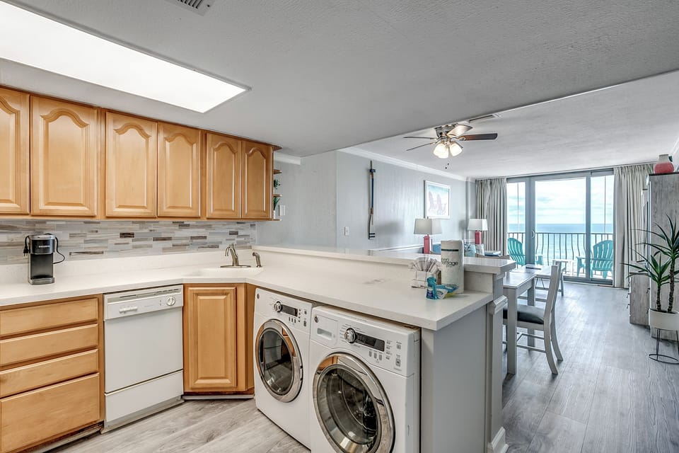 Large, open concept kitchen with dishwasher, coffee maker, and washer/dryer for your convenience.