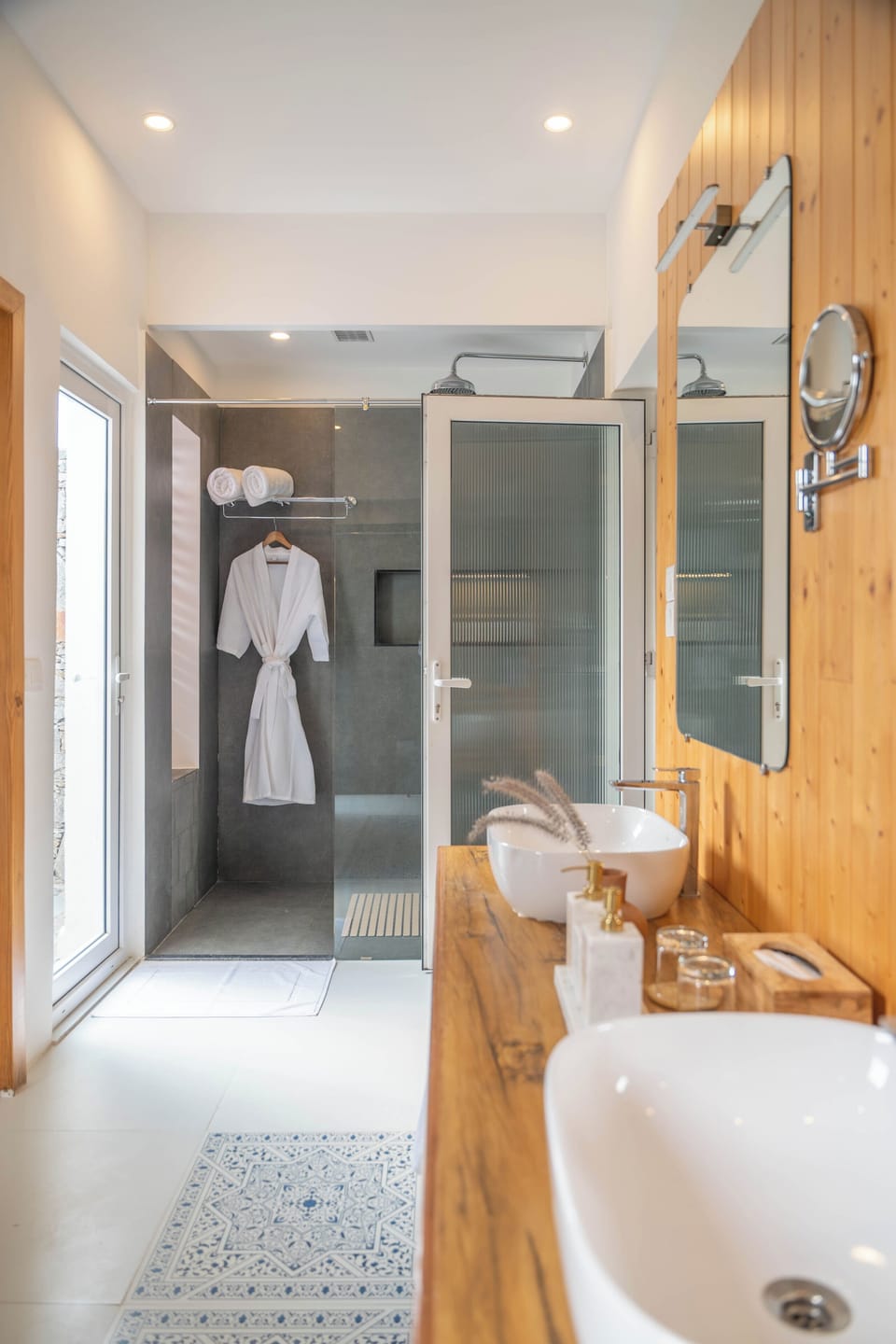 Separate tub and shower, designer toiletries, hair dryer, bathrobes