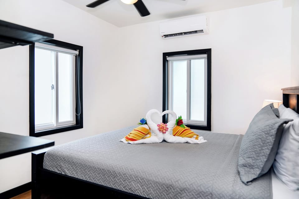 Bedroom with Queen bed.  Enjoy climate-controlled comfort and a charming welcome detail that makes you feel right at home.