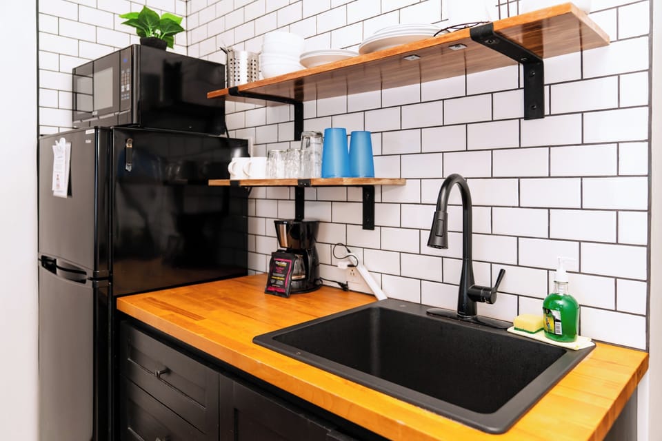 Kitchenette w/refrigerator, coffee maker, sink, hot plate