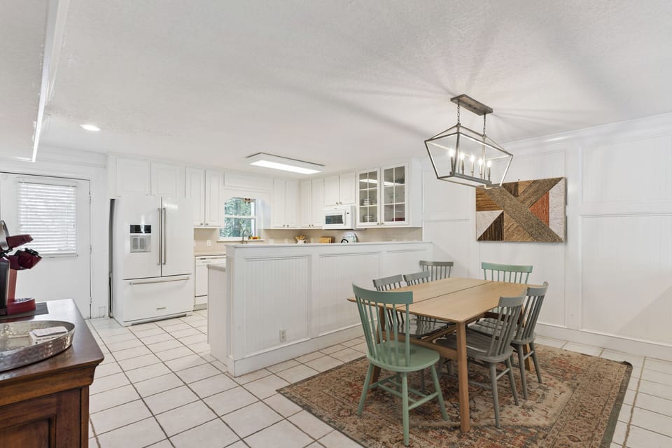Your bright, open kitchen flows seamlessly into a charming dining area where you'll enjoy memorable meals together.