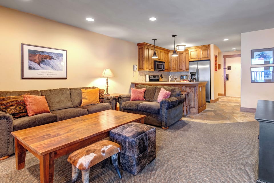 Relax in your spacious living room, seamlessly connected to a fully-equipped kitchen.