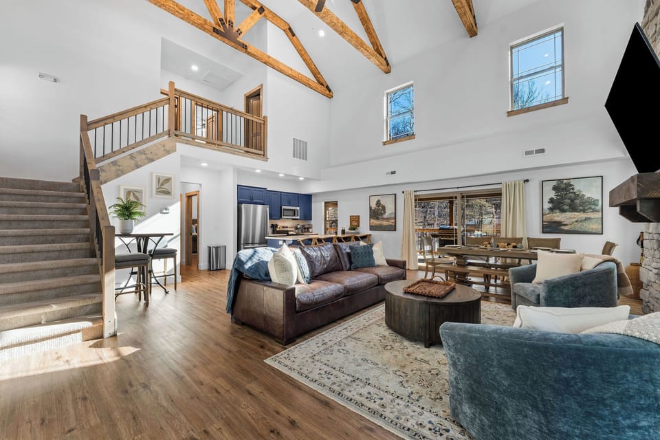 Walk in to the open-concept living space with vaulted ceilings, awesome wood beams and plenty of room to gather and relax.