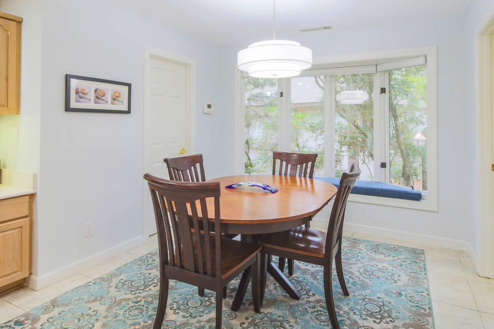 The kitchen dining table seats 4.
