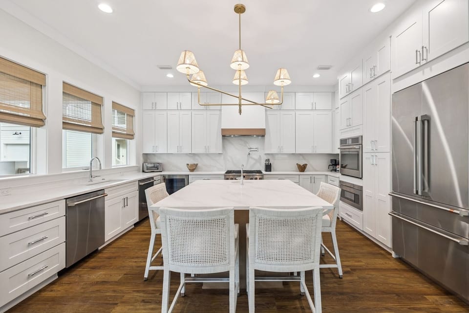 Your dream kitchen awaits with gleaming white cabinets, marble countertops, and professional-grade stainless steel appliances for memorable meal preparation.