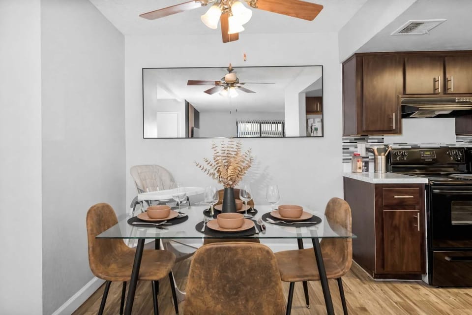 Elegant dining area with seating for four, plus a high chair for added convenience.